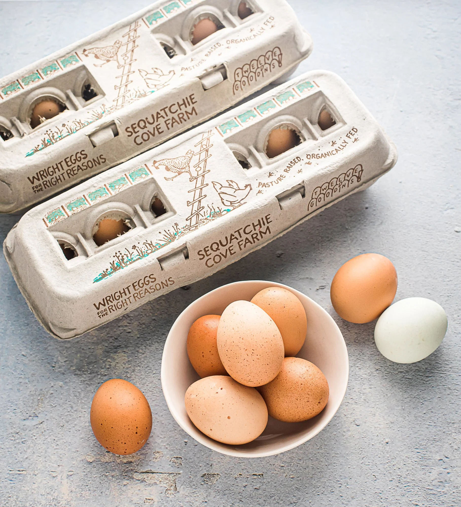 image-2 Fresh organic eggs from Sequatchie Cove Farm in eco-friendly packaging, displayed in a bowl. The image showcases various shades of eggs, emphasizing natural farming practices.